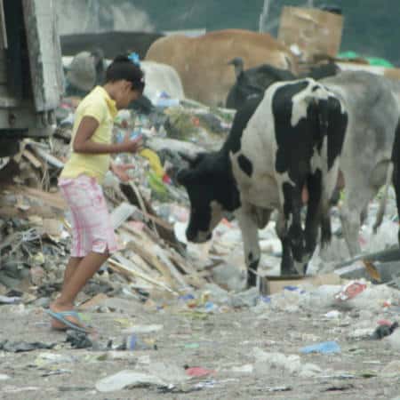 child living in the city dump